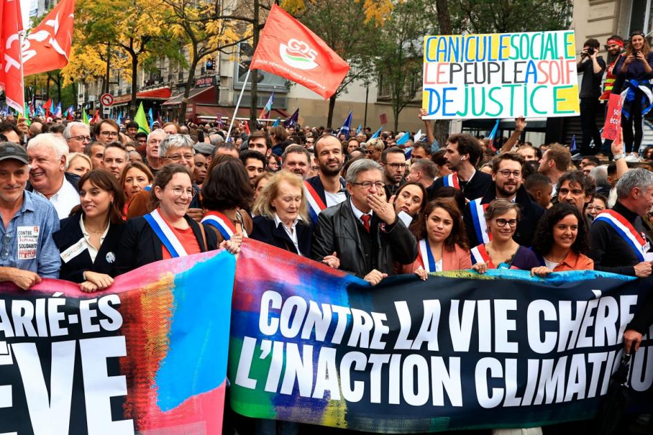 Protesters march in Paris to demonstrate against effects of rising inflation