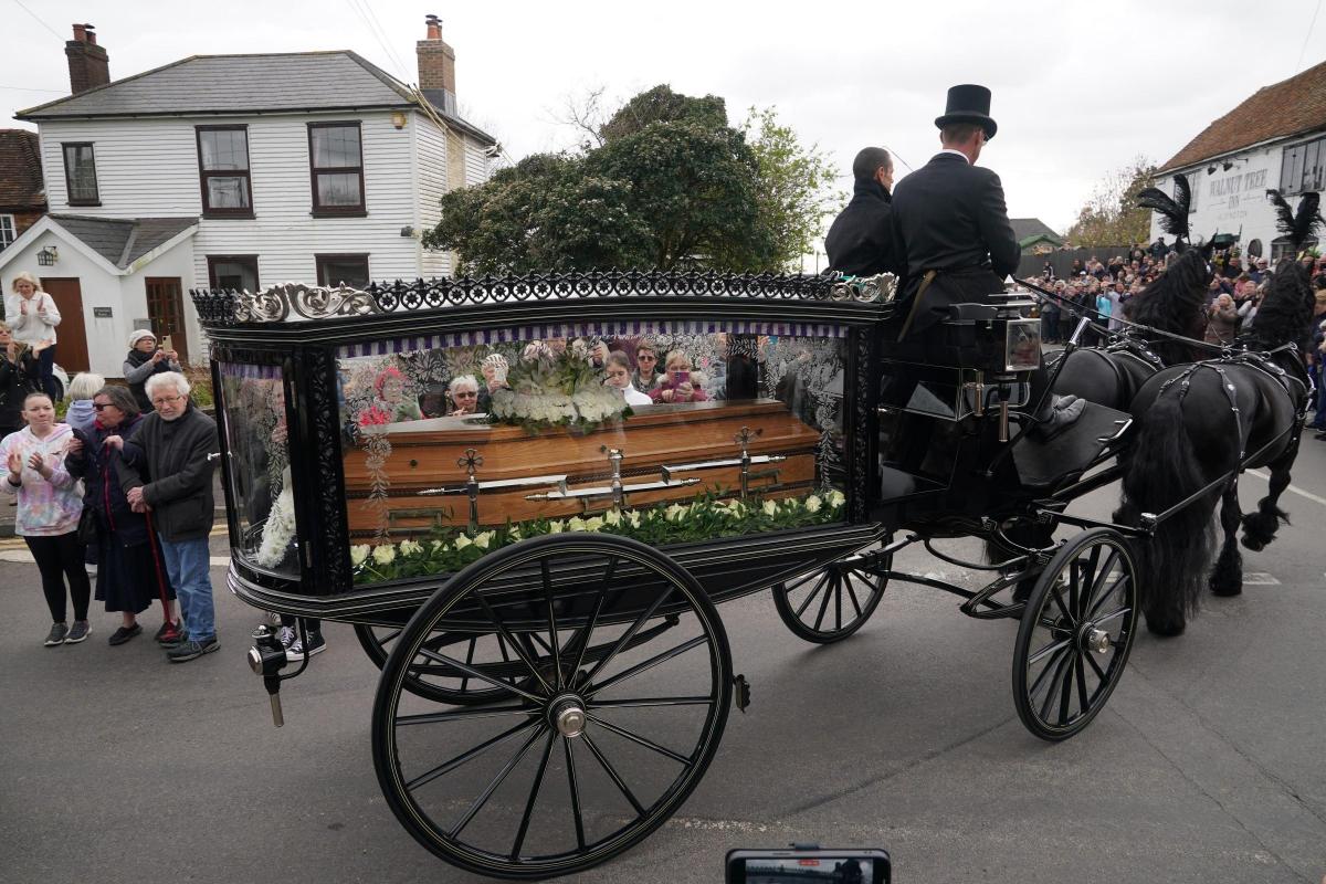 The casket arrives by hearse before the funeral at Chelmsford