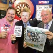 A good bet: Darts star Peter Manley, reporter Ryan McCarthy and branch manager Paul Sanders at Betfred in Newland Street, Witham