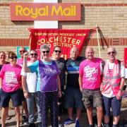 Strike action - postal workers formed a picket line outside Royal Mail's delivery office in Colchester