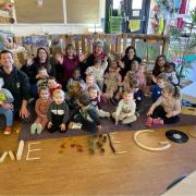 GLOWING REPORT: Staff and children celebrate the Ofsted feedback