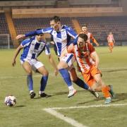 Battle - Colchester United's Gene Kennedy tussles with Matt Rush of Braintree Town during the BBC Essex Senior Cup quarter-final Picture: JON WEAVER