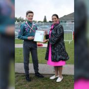 RECOGNISED - Dame Priti Patel presents Alexander with his Chief Scout’s Gold Award