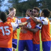 On target: Reggie Lambe celebrates his goal against Havant and Waterlooville with his Braintree Town team-mates.
