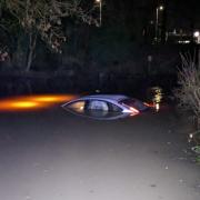The driver's car was nearly completely under water