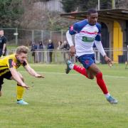 On the ball: Witham Town's Deese Kasinga-Madia brings the ball away against Basildon United. Picture: NIGEL HAKES