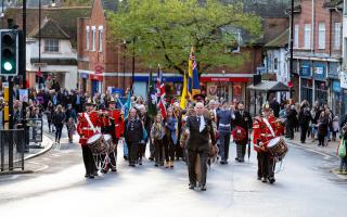 MARCHING ON: Halstead's procession makes its way through the town