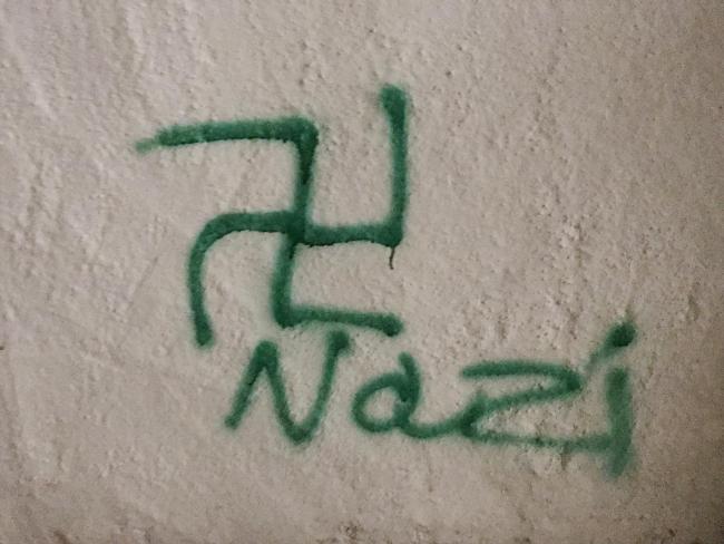 Racist yobs spray paint swastikas on newspaper's office